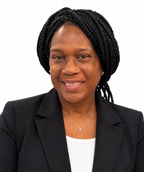 Rev. Lauren Harvey-Williams smiling, in a black blazer